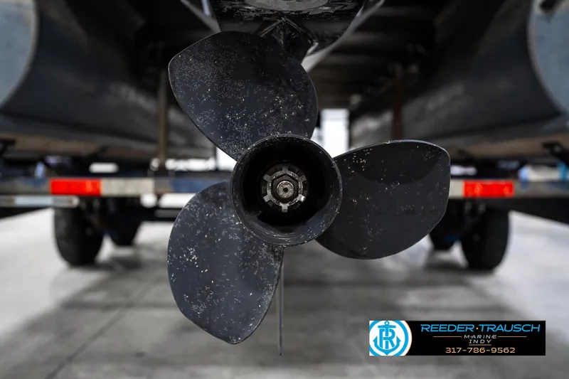 Slide: The Image of Propeller of 2016 Bennington 20 SLMX boat on trailer in garage. - 45
