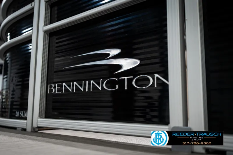 Slide: The Image of 2016 Bennington 20 SLMX boat logo with Reeder-Trausch branding and contact information. - 46