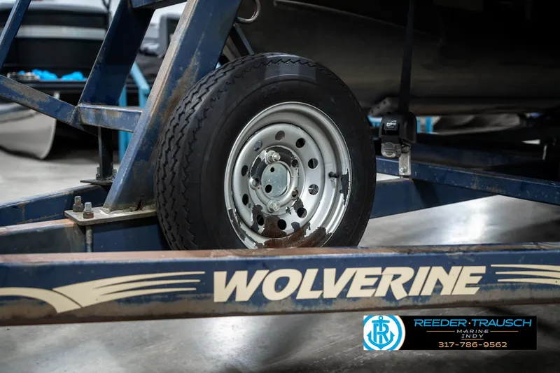 Slide: The Image of Trailer wheel of a 2016 Bennington 20 SLMX boat on Wolverine trailer. - 48