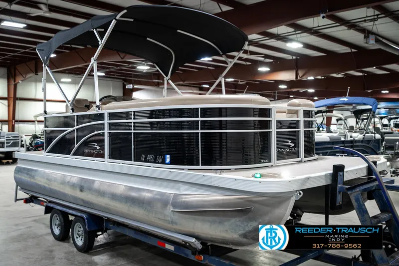 Slide: The Image of 2016 Bennington 20 SLMX pontoon boat on trailer in indoor showroom. - 6
