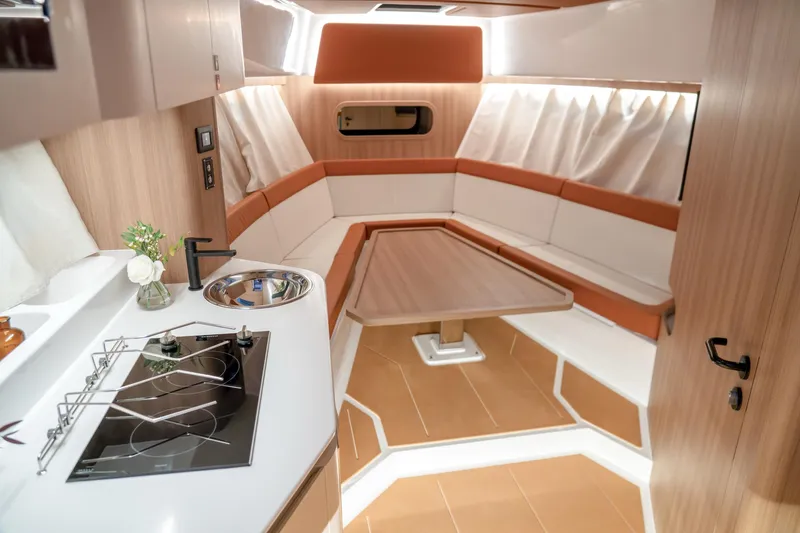 Slide: The Image of Luxurious interior of 2025 Oryx 37 FX yacht with modern kitchen and seating area. - 10