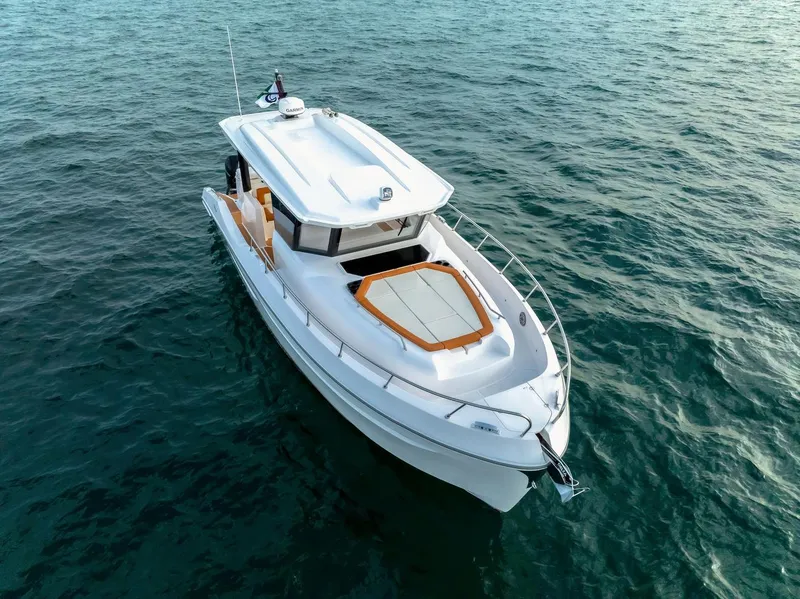 Slide: The Image of 2025 Oryx 37 FX boat cruising on open water, showcasing sleek design and modern features. - 4