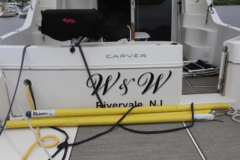 Slide: The Image of Carver 38 Super Sport 2012 boat docked, displaying "W's W" and "Rivervale, N.J." on the stern. - 15
