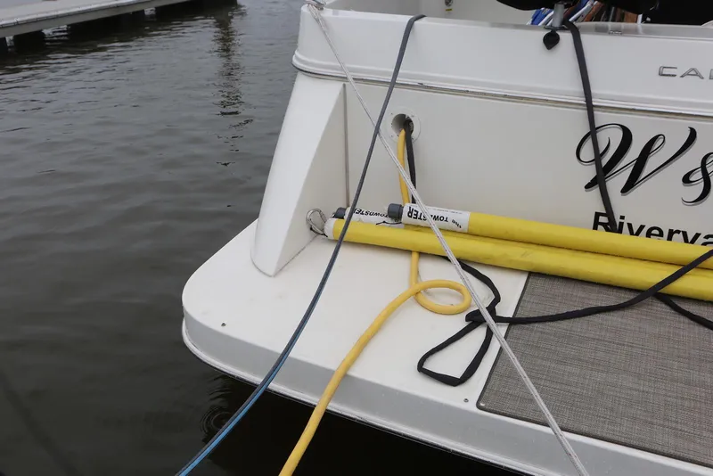 Slide: The Image of Carver 38 Super Sport 2012 boat docked with ropes and hoses on deck. - 16