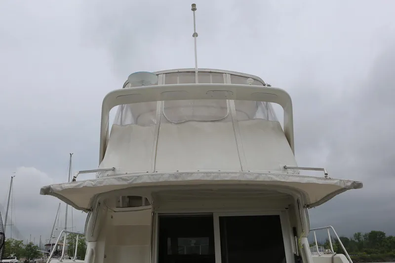 Slide: The Image of 2012 Carver 38 Super Sport yacht, rear view with overcast sky. - 18