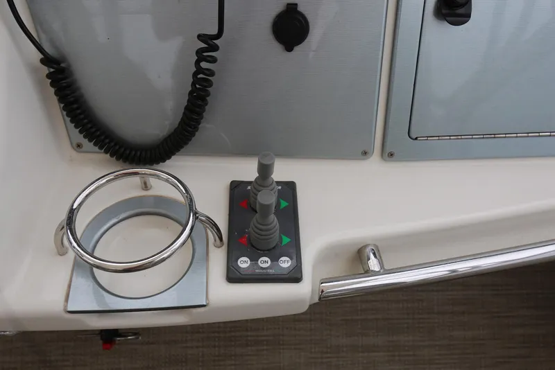 Slide: The Image of Control panel and cup holder on 2012 Carver 38 Super Sport boat. - 20