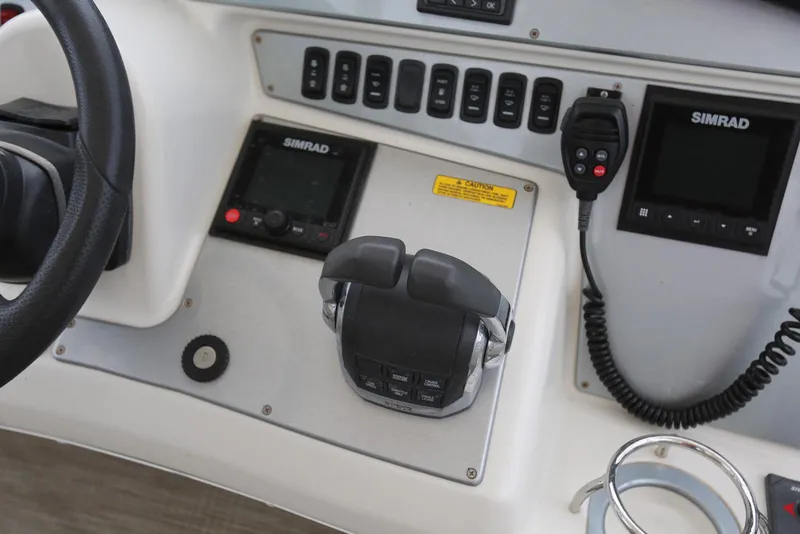 Slide: The Image of Control panel of 2012 Carver 38 Super Sport boat with Simrad electronics. - 23