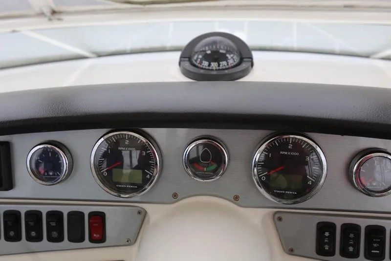 Slide: The Image of Dashboard of 2012 Carver 38 Super Sport with gauges and compass. - 26