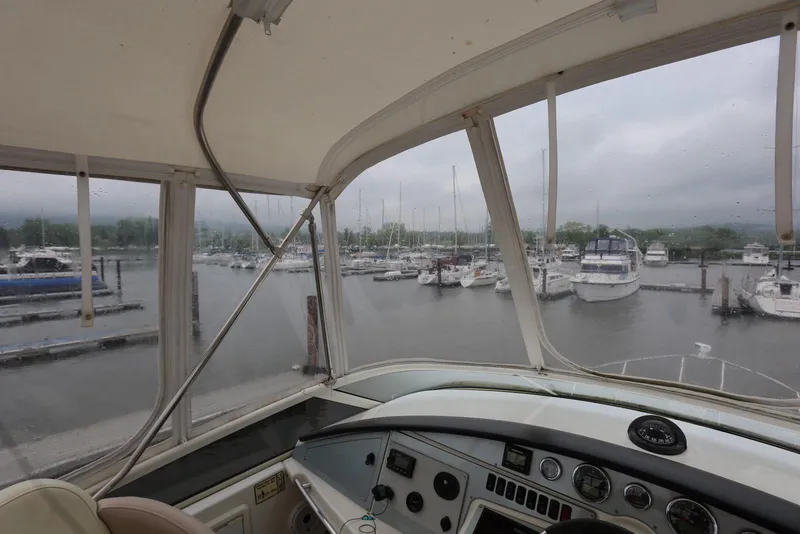 Slide: The Image of View from 2012 Carver 38 Super Sport yacht cockpit overlooking marina with boats. - 27