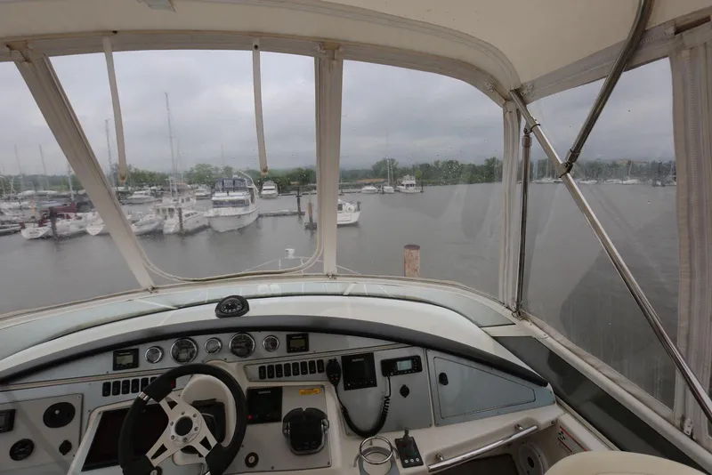 Slide: The Image of Cockpit view of 2012 Carver 38 Super Sport yacht in a marina. - 28