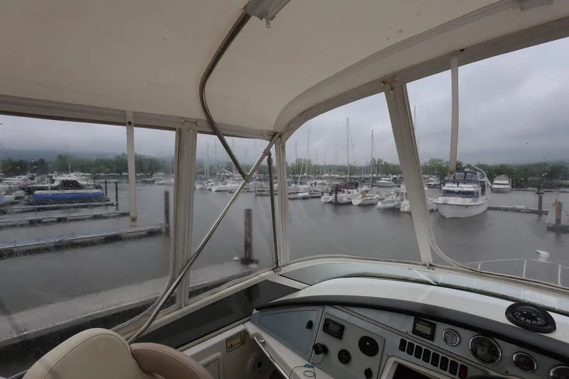 Slide: The Image of View from 2012 Carver 38 Super Sport yacht cockpit overlooking marina with docked boats. - 37