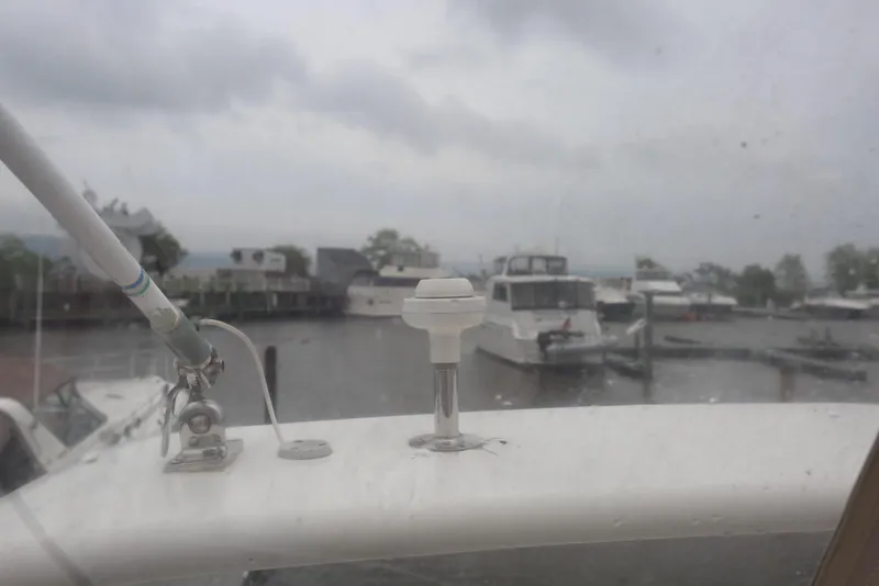 Slide: The Image of 2012 Carver 38 Super Sport yacht docked in a marina on a cloudy day. - 48