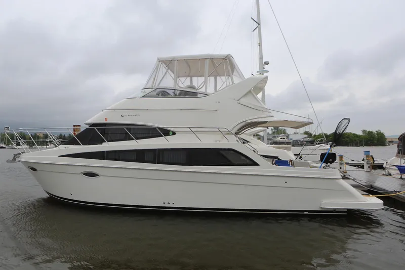 The Image of 2012 Carver 38 Super Sport yacht docked on a cloudy day. - 0