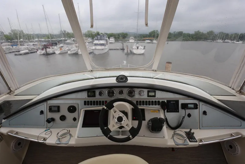 Slide: The Image of Helm of 2012 Carver 38 Super Sport yacht overlooking marina. - 17