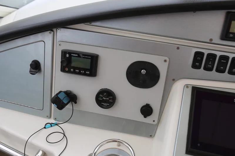 Slide: The Image of Control panel of a 2012 Carver 38 Super Sport boat with electronic displays. - 22