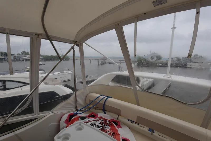 Slide: The Image of Interior view of 2012 Carver 38 Super Sport yacht at a marina on a cloudy day. - 30