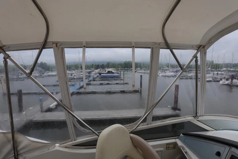 Slide: The Image of View from 2012 Carver 38 Super Sport yacht overlooking marina with docked boats. - 34