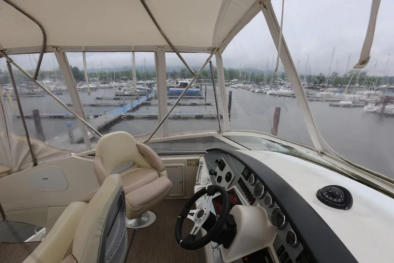Slide: The Image of Interior view of 2012 Carver 38 Super Sport yacht at marina. - 44