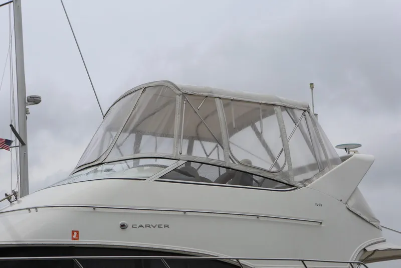 Slide: The Image of Carver 38 Super Sport 2012 yacht with enclosed cockpit against cloudy sky. - 6