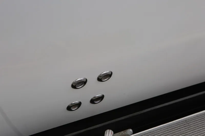 Slide: The Image of Close-up of 2012 Carver 38 Super Sport boat hull with metal fittings. - 8