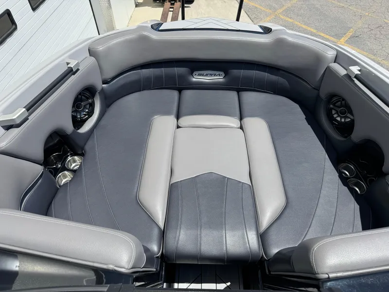 Slide: The Image of 2020 Supra SE550 boat interior with gray and black cushioned seating. - 8