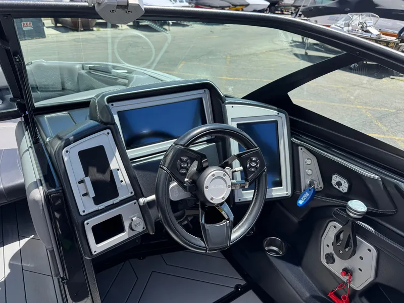 Slide: The Image of 2020 Supra SE550 boat dashboard with modern controls and digital displays. - 9