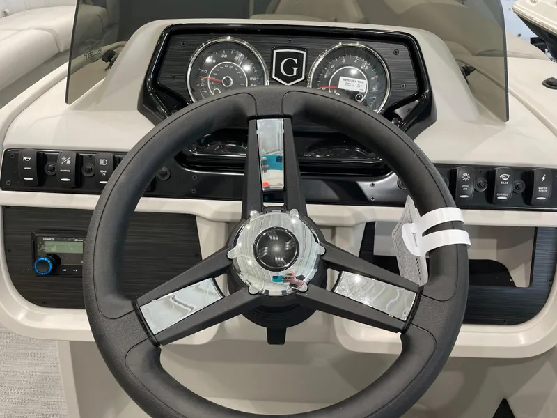 Slide: The Image of Steering wheel and dashboard of 2025 Godfrey SWEETWATER 2286 SB boat. - 11