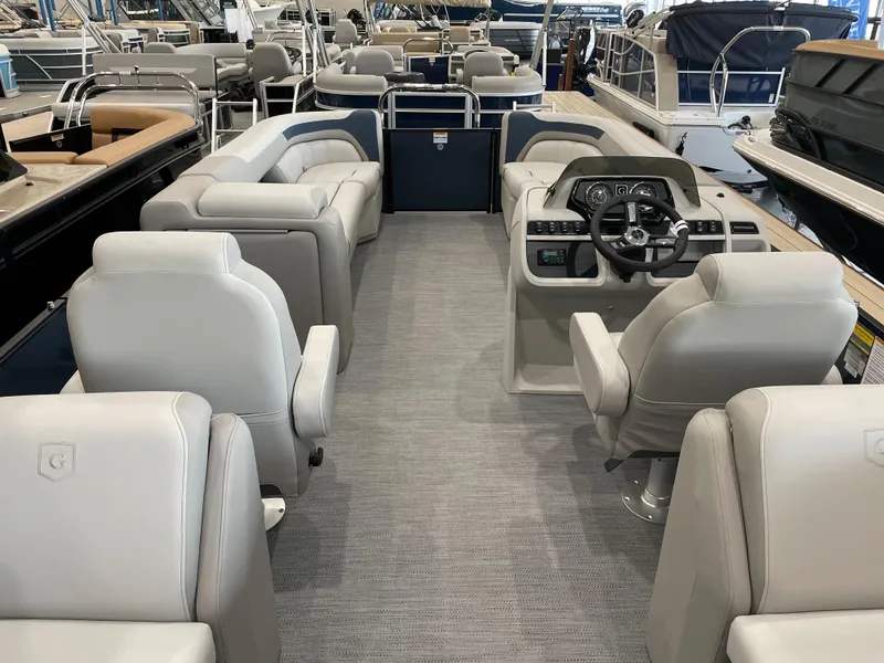Slide: The Image of 2025 Godfrey SWEETWATER 2286 SB pontoon boat interior with plush seating and modern helm. - 12
