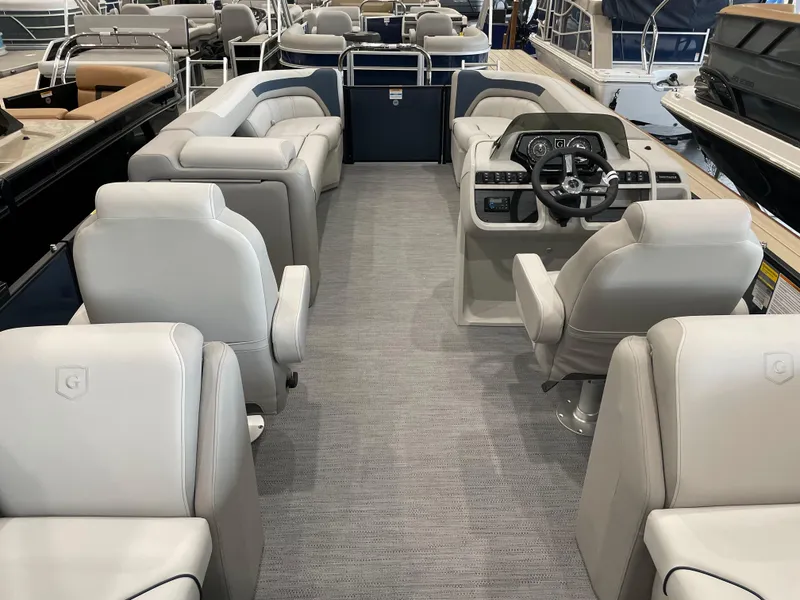 Slide: The Image of 2025 Godfrey SWEETWATER 2286 SB pontoon boat interior with plush seating and modern helm. - 13
