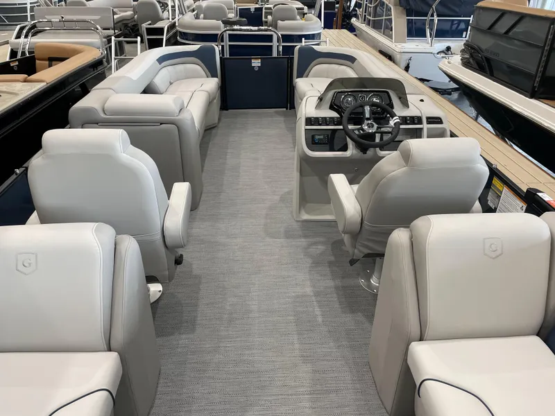 Slide: The Image of 2025 Godfrey SWEETWATER 2286 SB pontoon boat interior with plush seating and modern helm. - 14