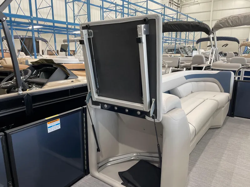 Slide: The Image of 2025 Godfrey SWEETWATER 2286 SB pontoon boat interior with open storage compartment. - 15