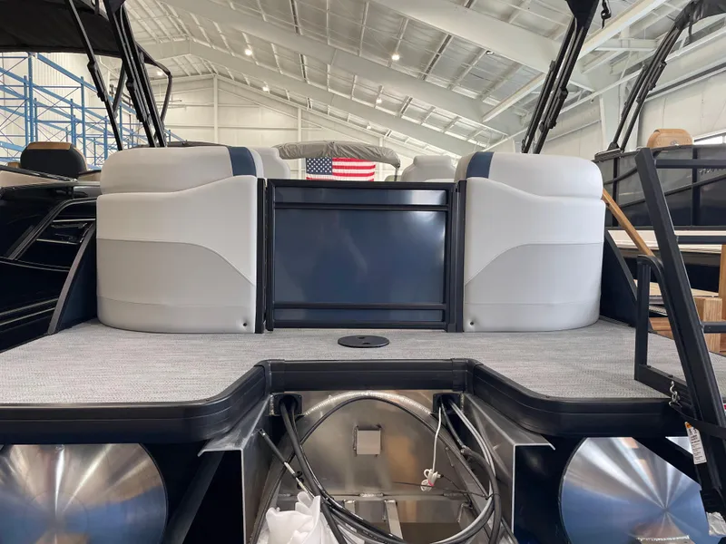 Slide: The Image of 2025 Godfrey SWEETWATER 2286 SB pontoon boat interior with modern seating and American flag. - 16