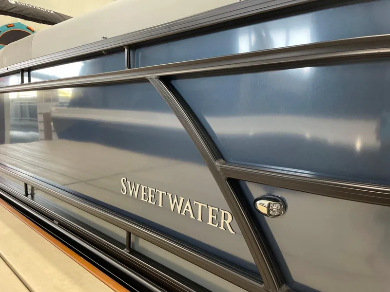 Slide: The Image of 2025 Godfrey SWEETWATER 2286 SB pontoon boat, sleek blue exterior detail. - 17