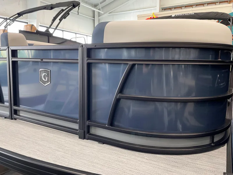 Slide: The Image of 2025 Godfrey SWEETWATER 2286 SB pontoon boat, sleek blue design, modern interior. - 2
