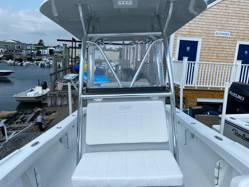Slide: The Image of 2025 Pair Customs 21 Center Console DV boat docked at a marina. - 11