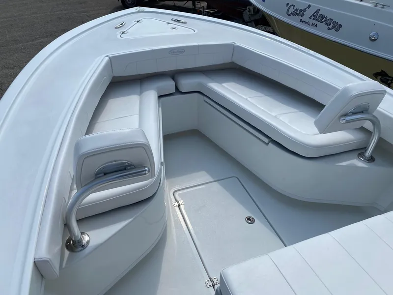Slide: The Image of 2025 Pair Customs 21 Center Console DV boat with white cushioned seating. - 13