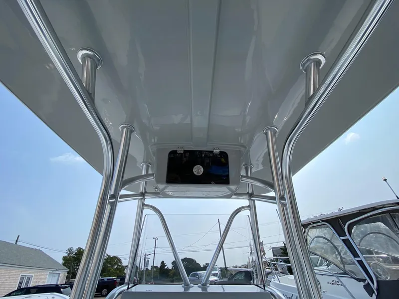 Slide: The Image of 2025 Pair Customs 21 Center Console DV boat with sleek T-top design. - 14