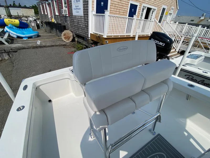 Slide: The Image of 2025 Pair Customs 21 Center Console DV boat with sleek seating and modern design. - 17