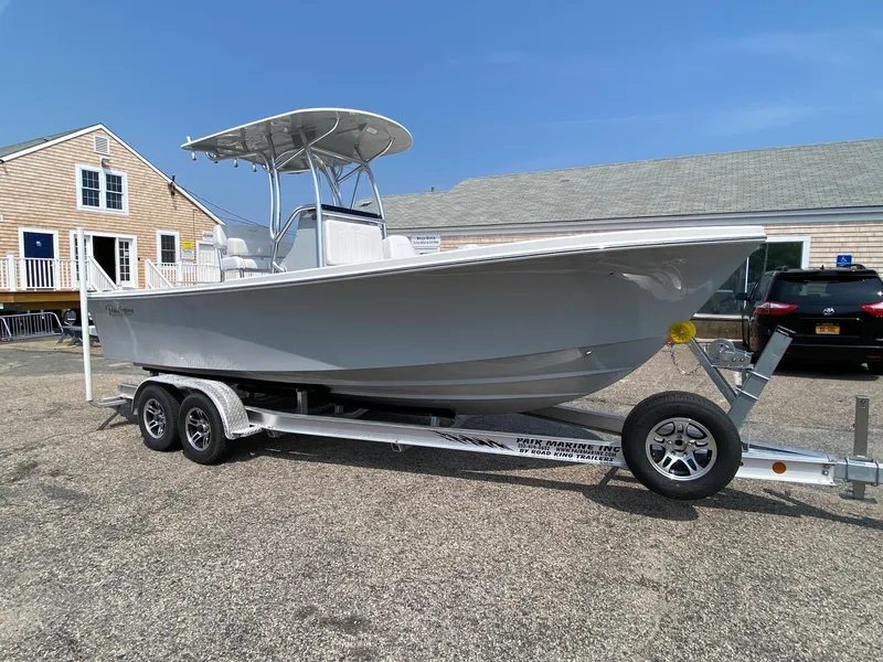 Slide: The Image of 2025 Pair Customs 21 Center Console DV boat on trailer, parked outdoors. - 3