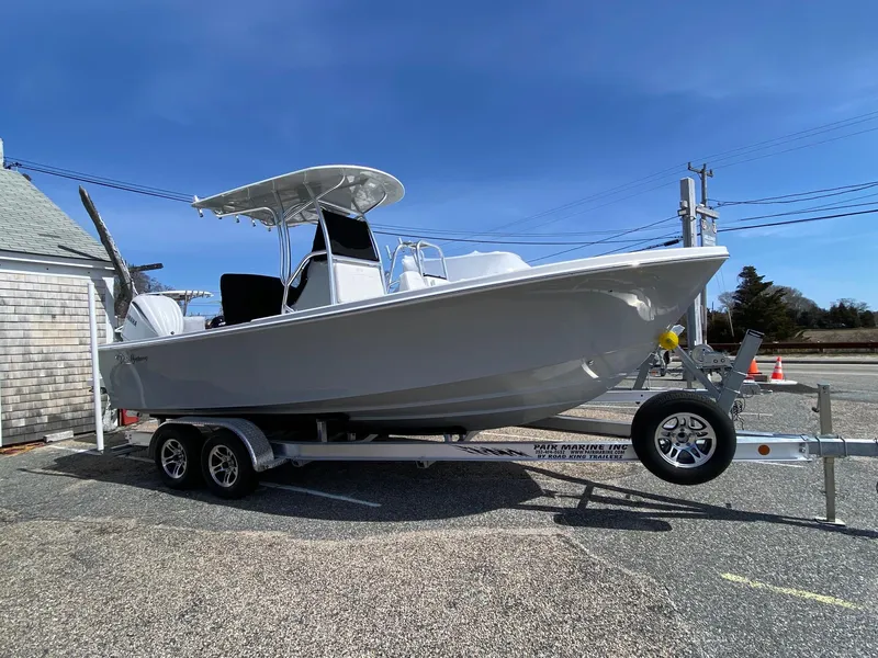 Slide: The Image of 2025 Pair Customs 21 Center Console DV boat on trailer, parked outdoors. - 5