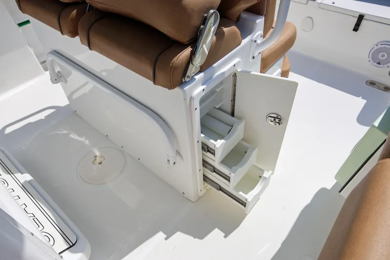 Slide: The Image of 2019 Sea Hunt Ultra 255 SE boat interior with open storage compartments. - 15