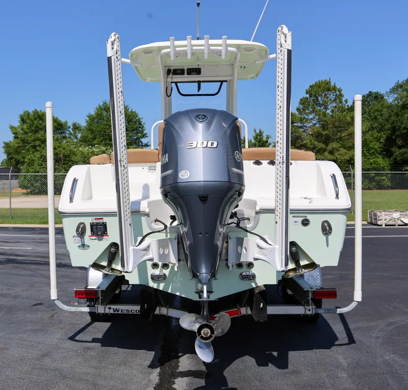 Slide: The Image of 2019 Sea Hunt Ultra 255 SE boat with Yamaha 300 engine, rear view. - 2