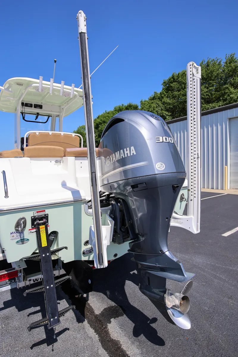 Slide: The Image of 2019 Sea Hunt Ultra 255 SE boat with Yamaha 300 outboard motor in a sunny setting. - 25