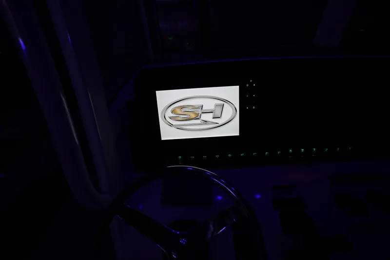 Slide: The Image of Dashboard of 2019 Sea Hunt Ultra 255 SE boat with illuminated logo. - 28