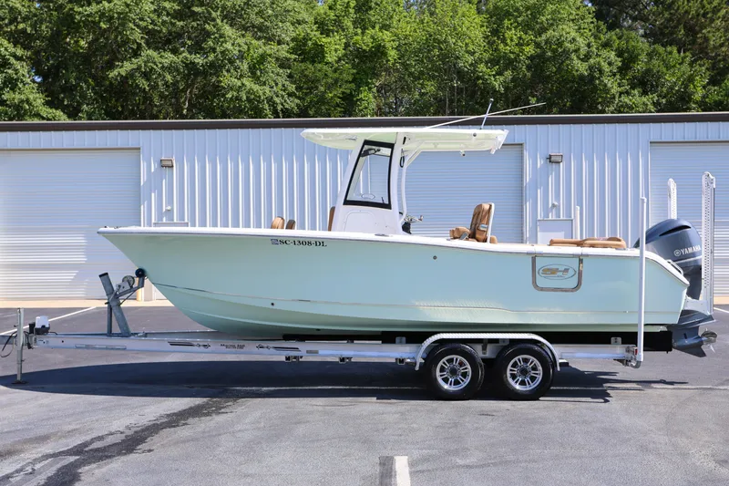 Slide: The Image of 2019 Sea Hunt Ultra 255 SE boat on trailer, parked outdoors. - 4