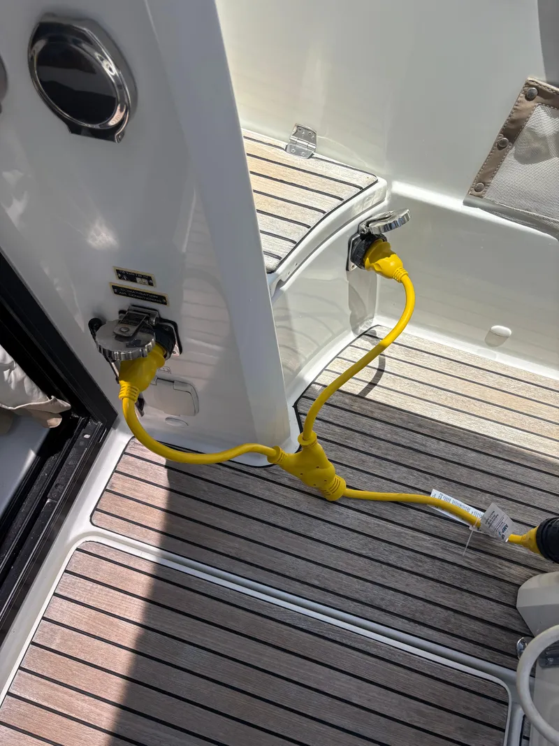 Slide: The Image of Yellow power cables on Jeanneau Merry Fisher 855 boat deck, 2018 model. - 11