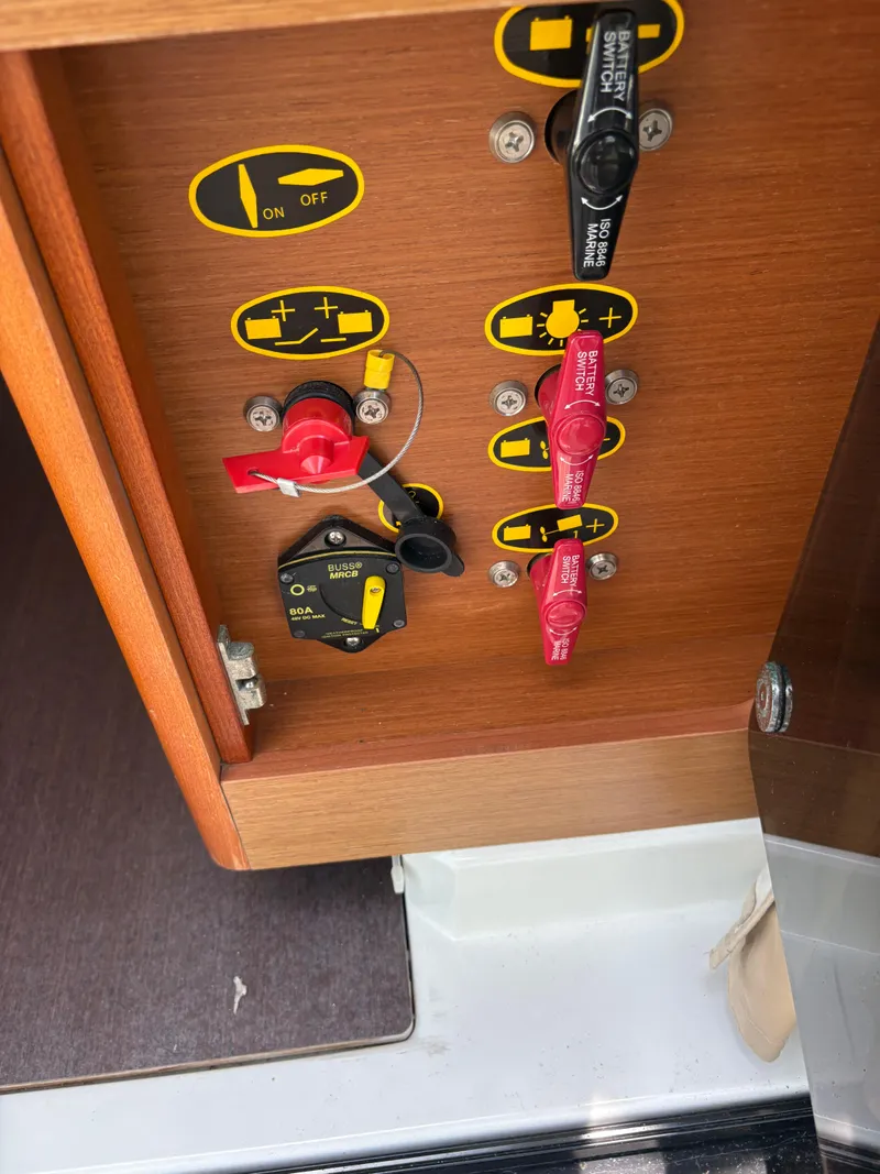 Slide: The Image of Control panel on a 2018 Jeanneau Merry Fisher 855 boat, featuring switches and indicators. - 12