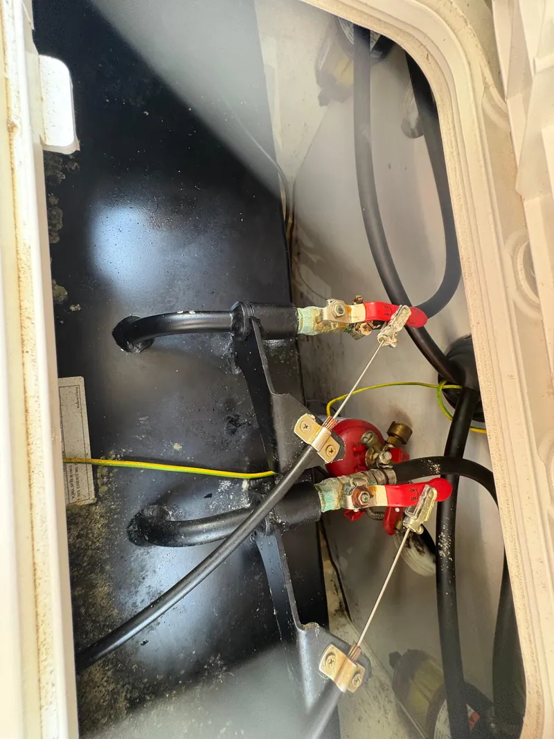 Slide: The Image of Battery compartment of 2018 Jeanneau Merry Fisher 855 boat with wiring connections. - 14