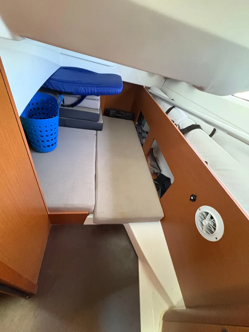 Slide: The Image of 2018 Jeanneau Merry Fisher 855 interior with seating and storage area. - 20