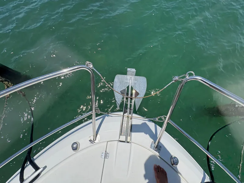 Slide: The Image of Bow view of 2018 Jeanneau Merry Fisher 855 on clear water. - 22